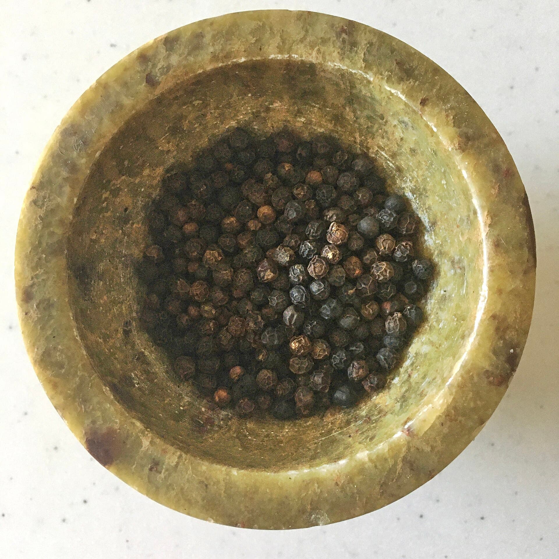 GR Stories | Black peppercorns in a mortar
